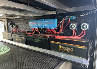 RV Solar Power installation in Brinkley RV. Controllers and batteries shown.